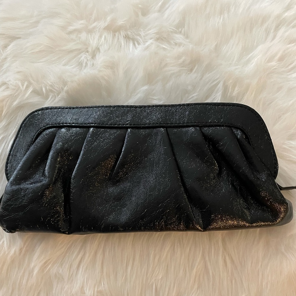 Simple black shimmering clutch. Like new.  5” X 12”. Zipper close